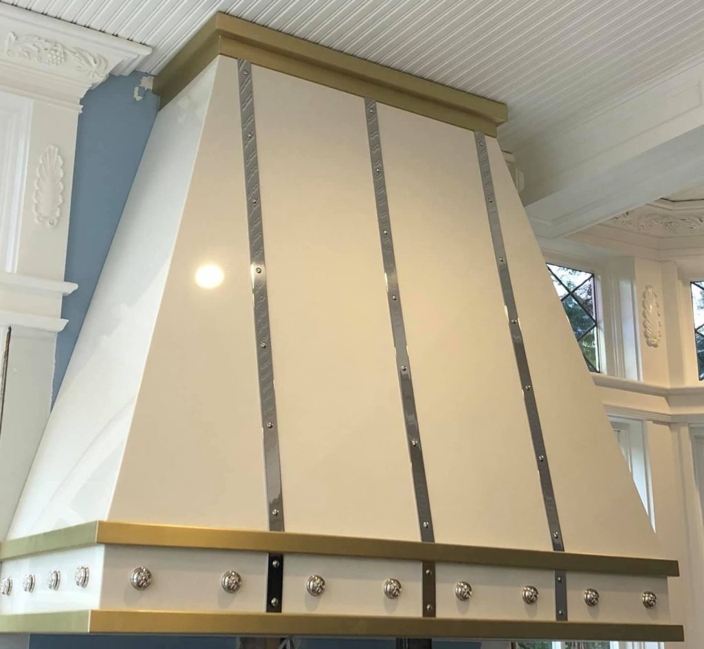 Painted range hood with brass trim